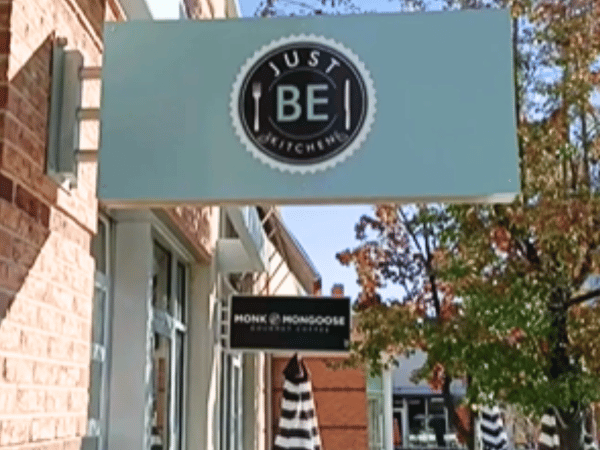 The signage of Just BE Kitchen, a dog-friendly patio or dog-friendly restaurant in Denver