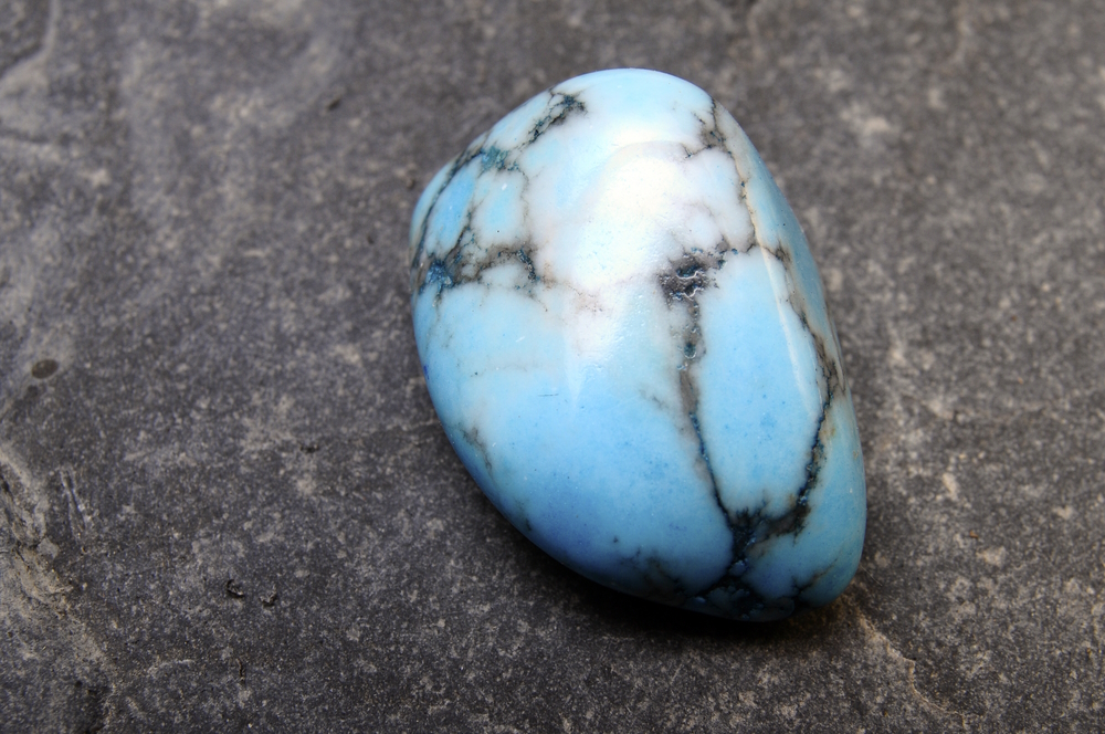 blue-and-black-turquoise-stone-on-mineral-background