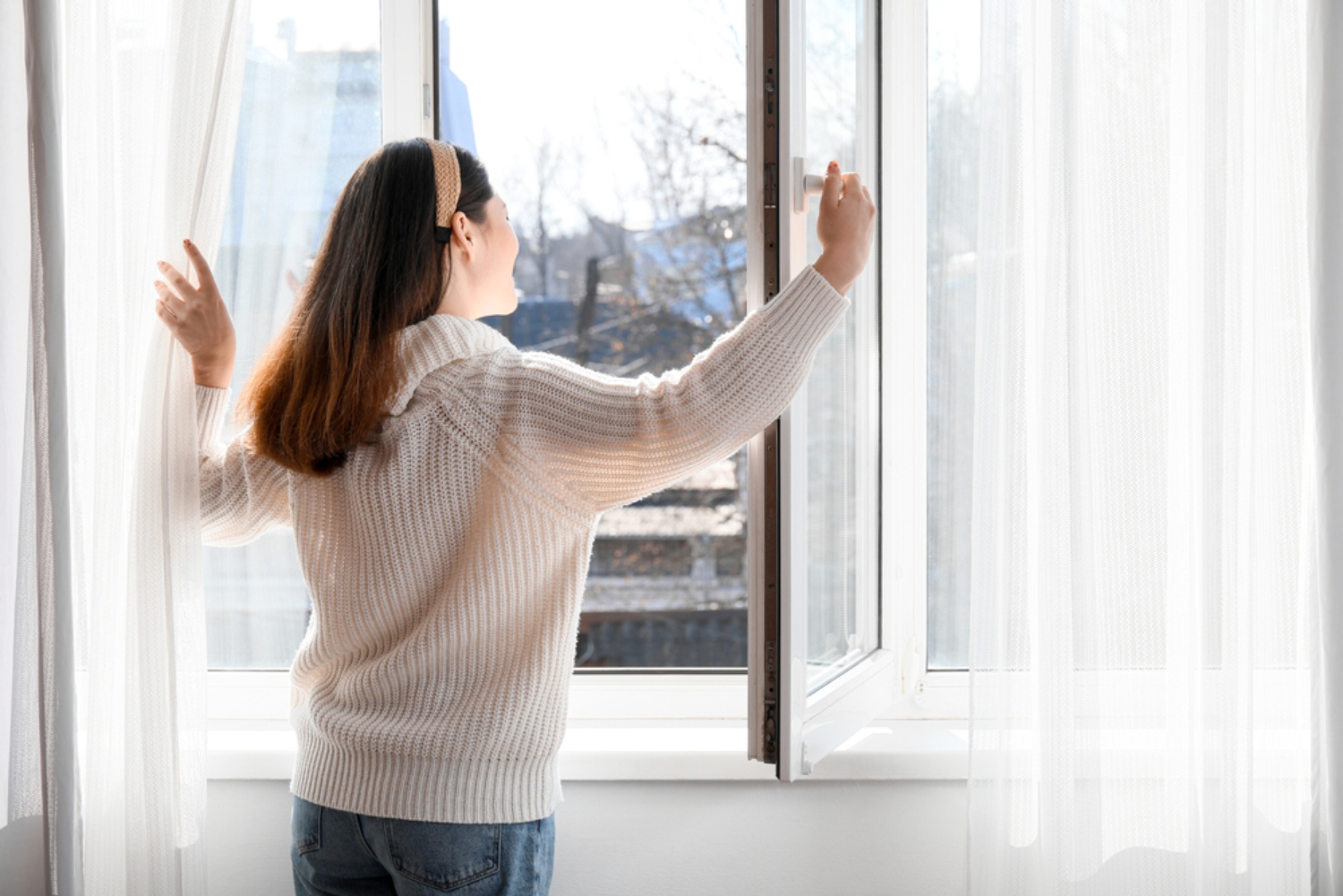 woman opening the window